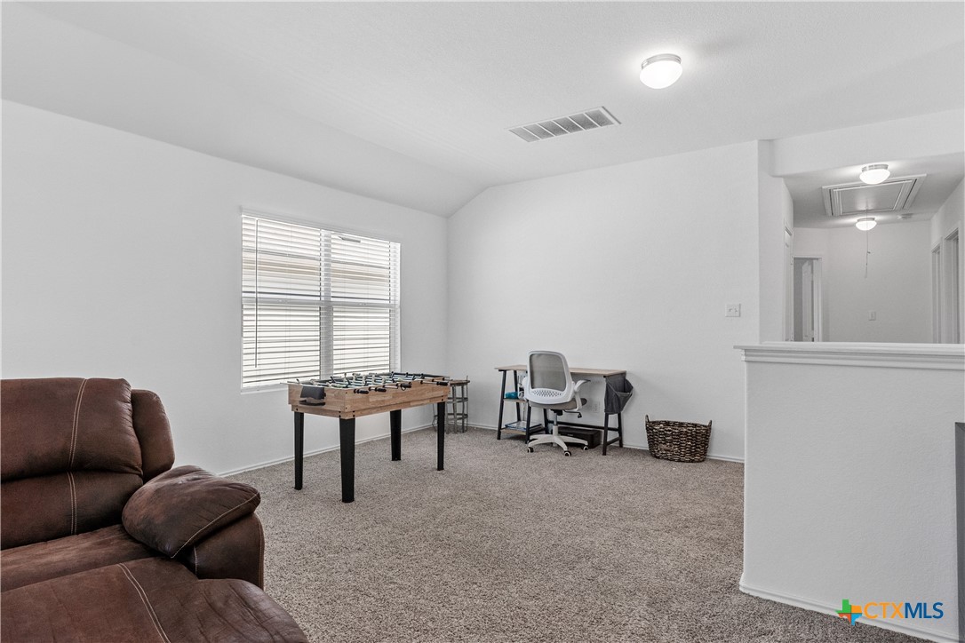 129 Rowdy Yates Way Jarrell, TX 76537 - Photo 28 of 41 a living room with furniture and a window