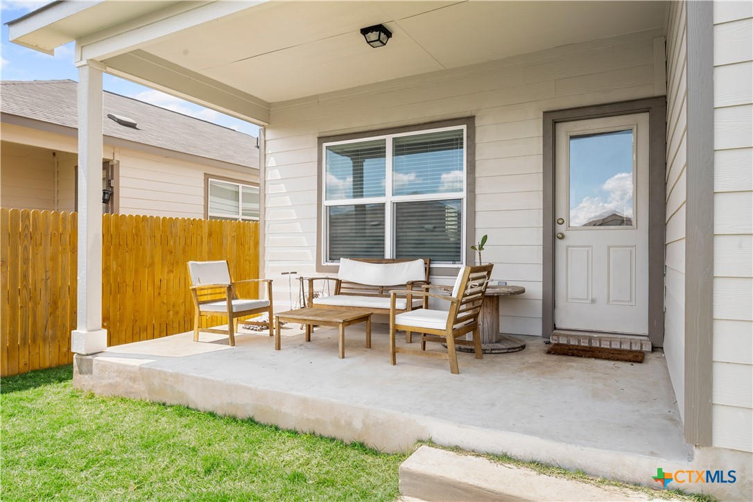 129 Rowdy Yates Way Jarrell, TX 76537 - Photo 35 of 41 a living room with furniture and large windows