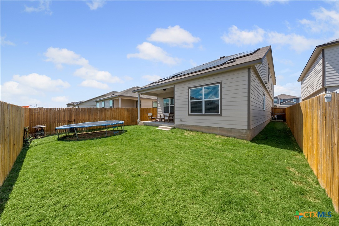 129 Rowdy Yates Way Jarrell, TX 76537 - Photo 36 of 41 a house view with a garden space