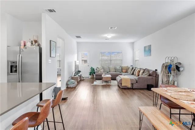 a living room with furniture and a table