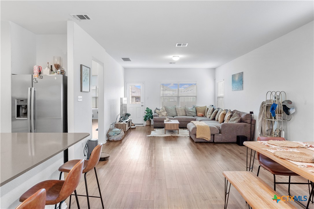 129 Rowdy Yates Way Jarrell, TX 76537 - Photo 6 of 41 a living room with furniture and a table