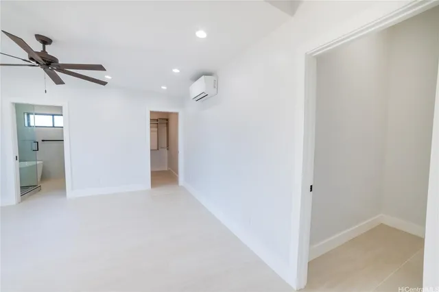 a view of an empty room and a window