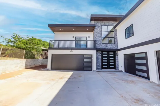 a view of an empty room with a fireplace and a potted plant