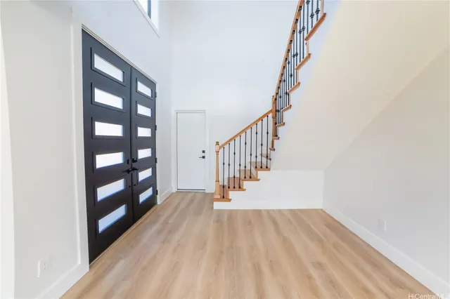 a view of entryway with wooden floor