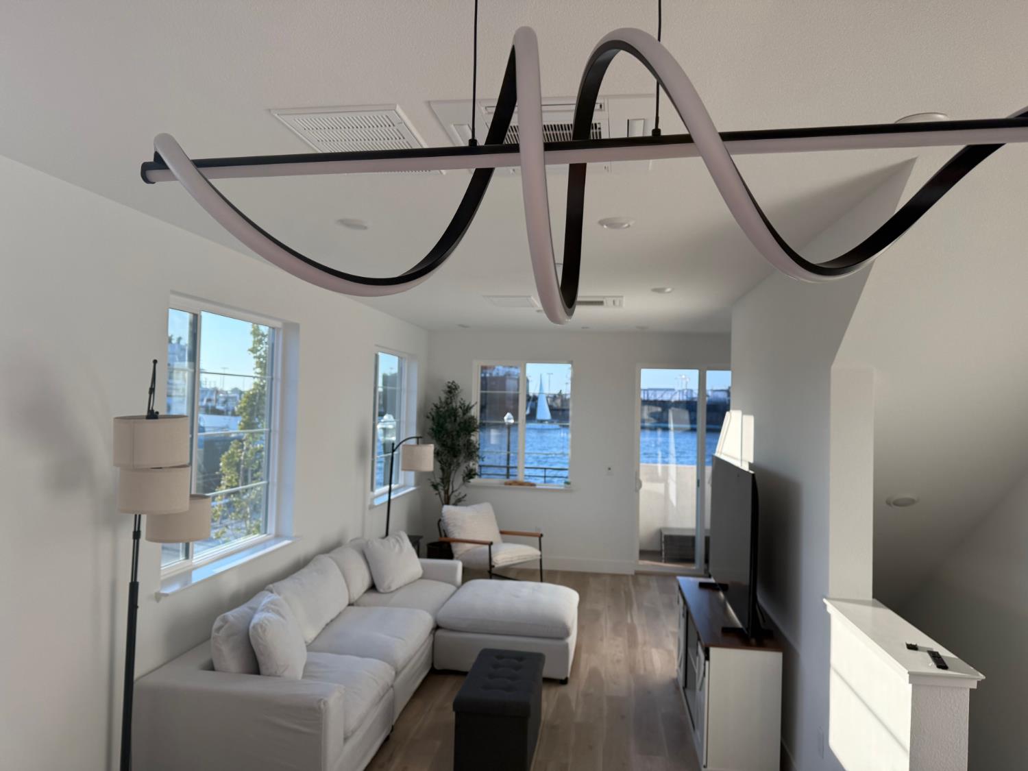 405 Sentinel Drive Alameda, CA 94501 - Photo 14 of 29 a living room with furniture and a window