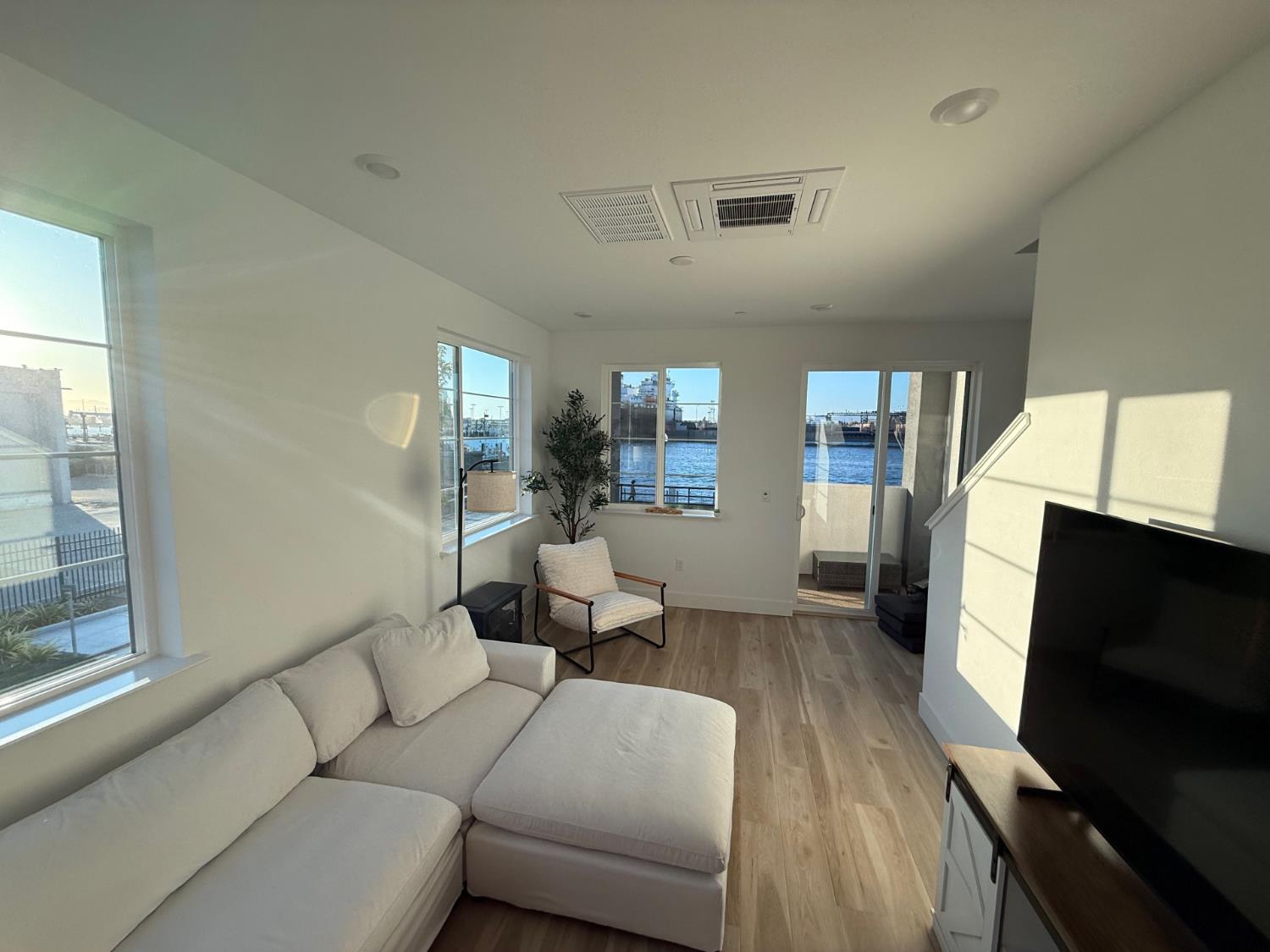 405 Sentinel Drive Alameda, CA 94501 - Photo 18 of 29 a living room with furniture and a flat screen tv
