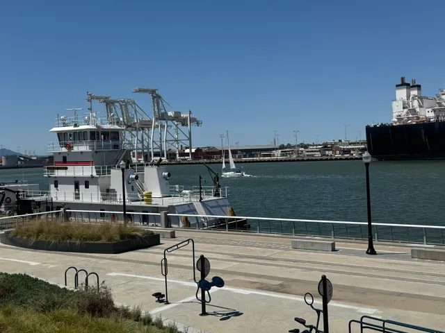 a living room with furniture wooden floor and a flat screen tv