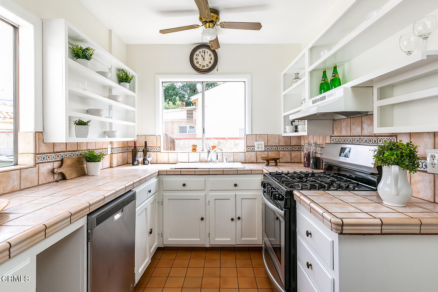 2023 Queensberry Road Pasadena, CA 91104 - Photo 12 of 26 a kitchen with a stove a sink and a window