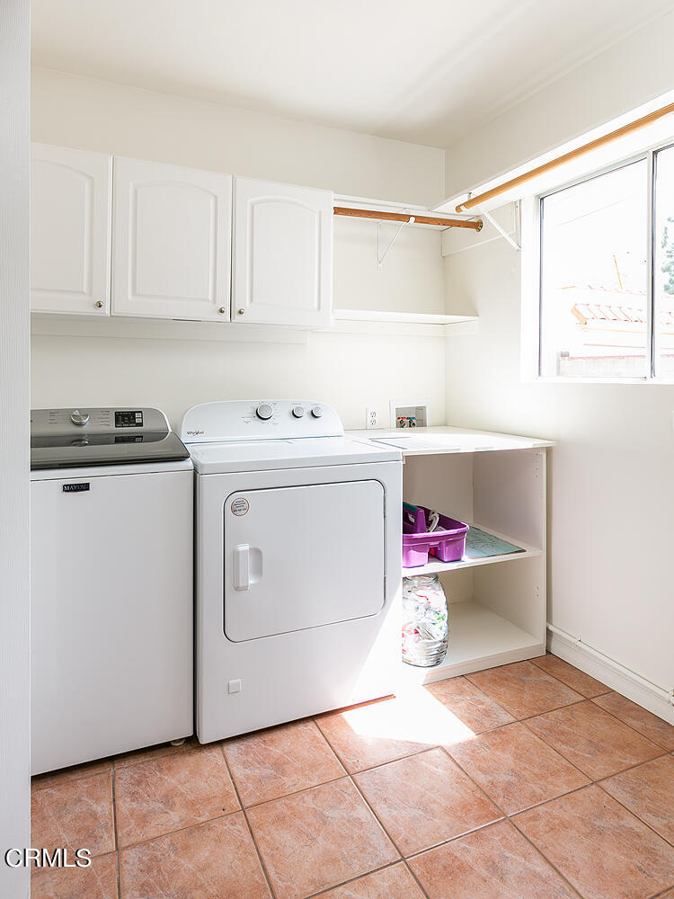 2023 Queensberry Road Pasadena, CA 91104 - Photo 22 of 26 a utility room with cabinets washer and dryer