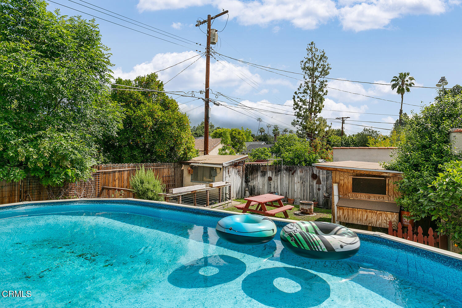 2023 Queensberry Road Pasadena, CA 91104 - Photo 25 of 26 a backyard of a house with fireplace table and chairs