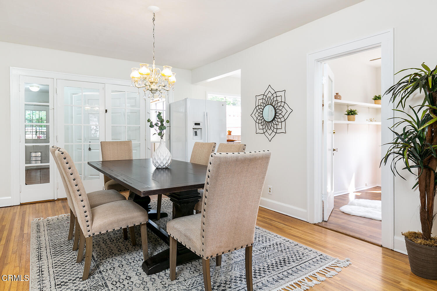 2023 Queensberry Road Pasadena, CA 91104 - Photo 10 of 26 a dining room with furniture potted plants and wooden floor