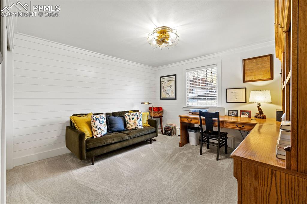 2 Cresta Road Colorado Springs, CO 80906 - Photo 13 of 33 a living room with furniture and a chandelier