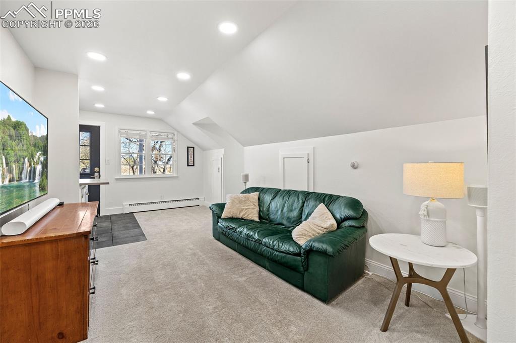 2 Cresta Road Colorado Springs, CO 80906 - Photo 23 of 33 a living room with furniture and a flat screen tv