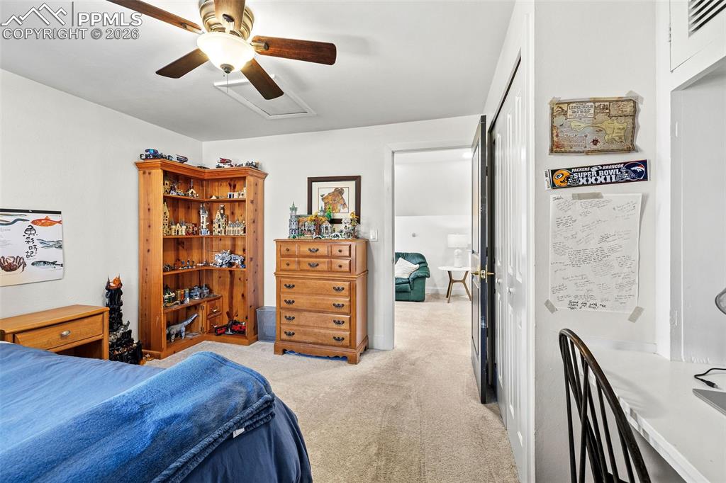 2 Cresta Road Colorado Springs, CO 80906 - Photo 25 of 33 a view of a bedroom with furniture and closet