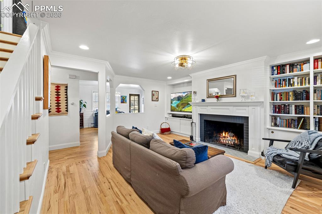2 Cresta Road Colorado Springs, CO 80906 - Photo 4 of 33 a living room with furniture and a fireplace