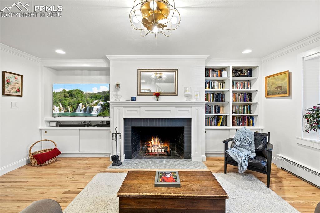 2 Cresta Road Colorado Springs, CO 80906 - Photo 6 of 33 a living room with furniture and a fireplace