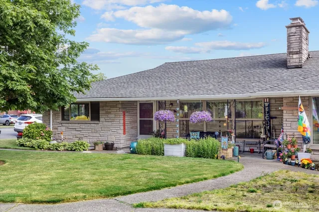 a front view of a house with garden