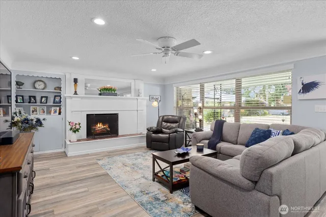 a living room with furniture and a fireplace