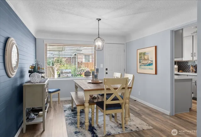 a view of a dining room with furniture window and outside view