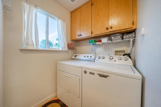a white toilet sitting next to a bathtub