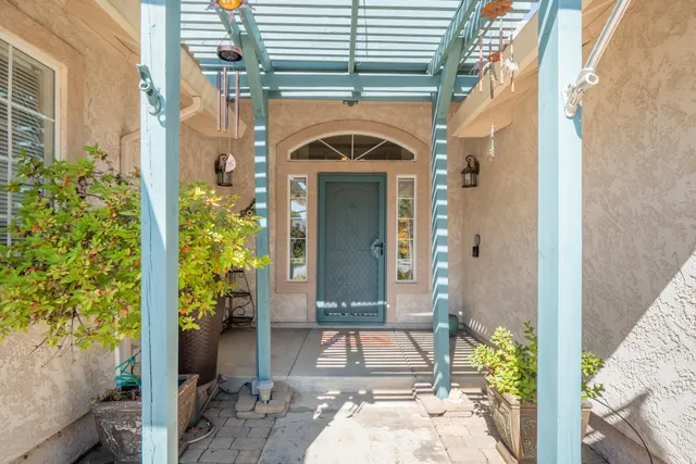 a view of an entryway with wooden floor