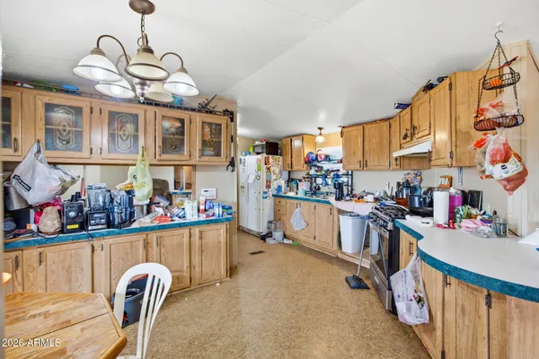 a kitchen filled with stainless steel appliances granite countertop a sink and cabinets