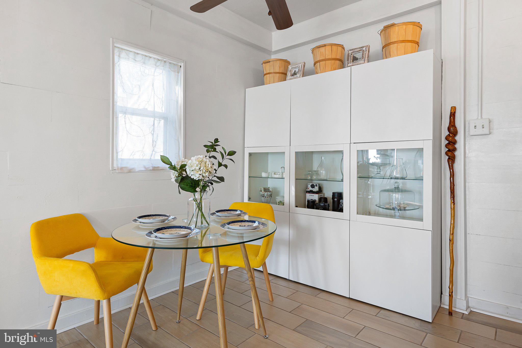 9 South New Road Middletown, DE 19709 - Photo 18 of 41 a view of a dining room with furniture and a potted plant