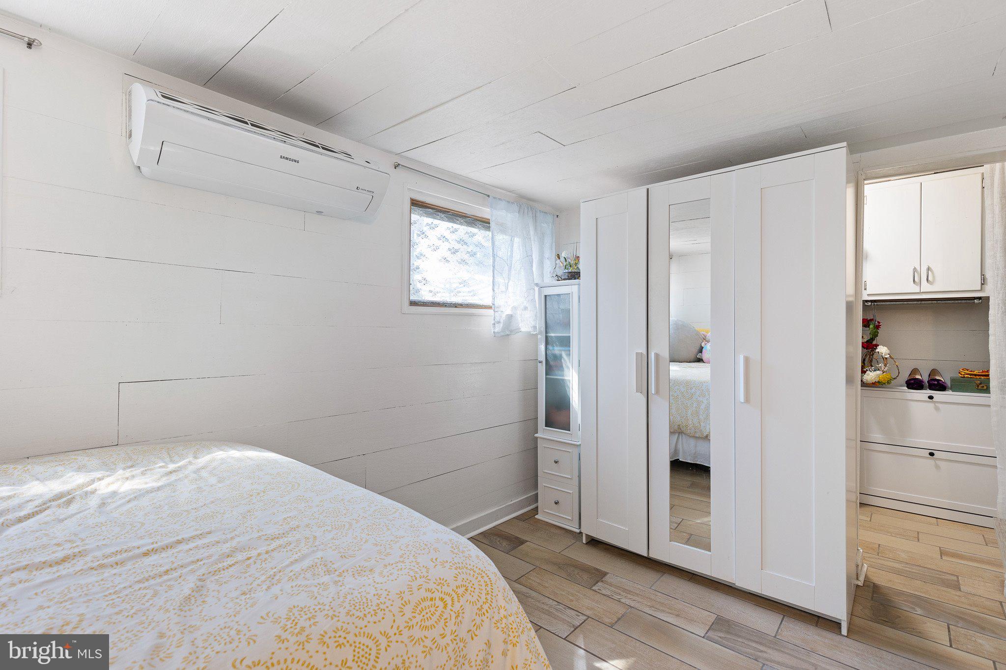 9 South New Road Middletown, DE 19709 - Photo 26 of 41 a bedroom with a bed and a cabinets