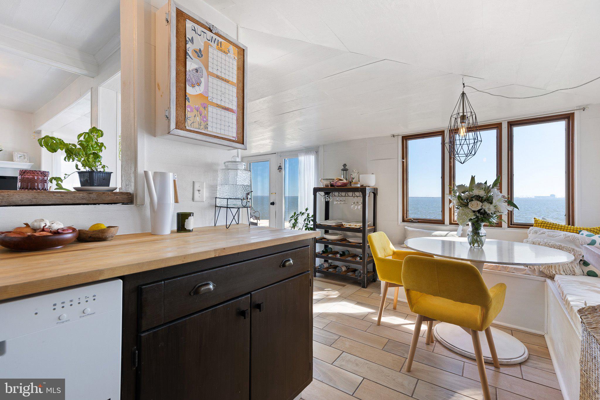 9 South New Road Middletown, DE 19709 - Photo 9 of 41 a kitchen with a sink a table and chairs in it