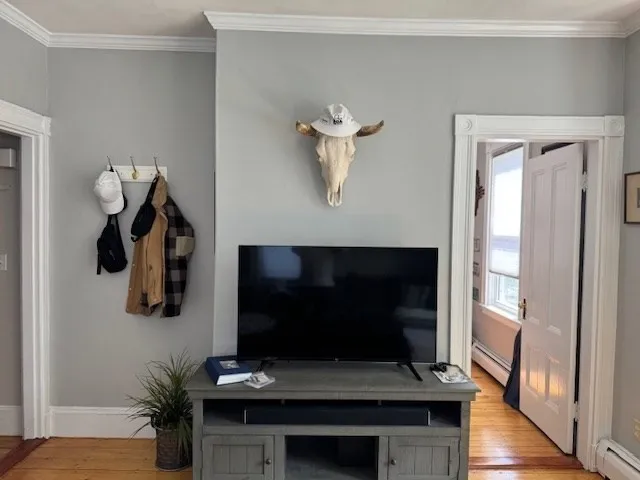 a living room with furniture and a flat screen tv