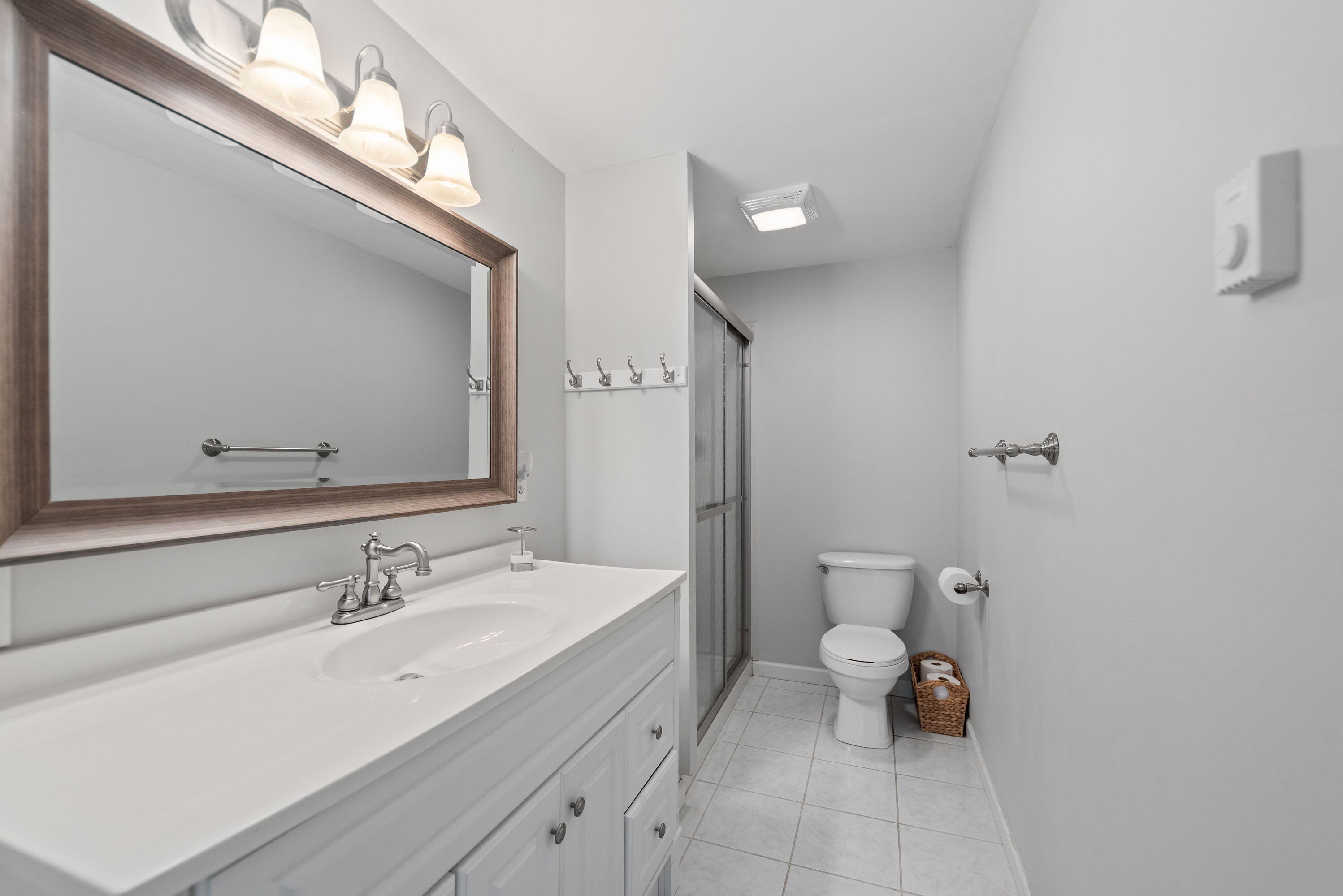 2005 Oriole Trail Long Beach, IN 46360 - Photo 14 of 23 a bathroom with a sink mirror and toilet