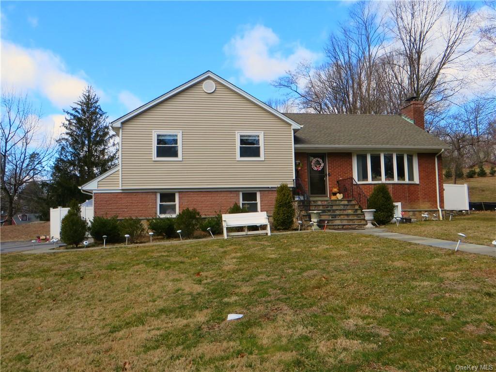Front view of 8 Macy Road, Briarcliff Manor.  4 Bedroom, 3 bath, 2 car garage, deck totally updated!  Mint move in fenced-in yard. .56 acre parcel.