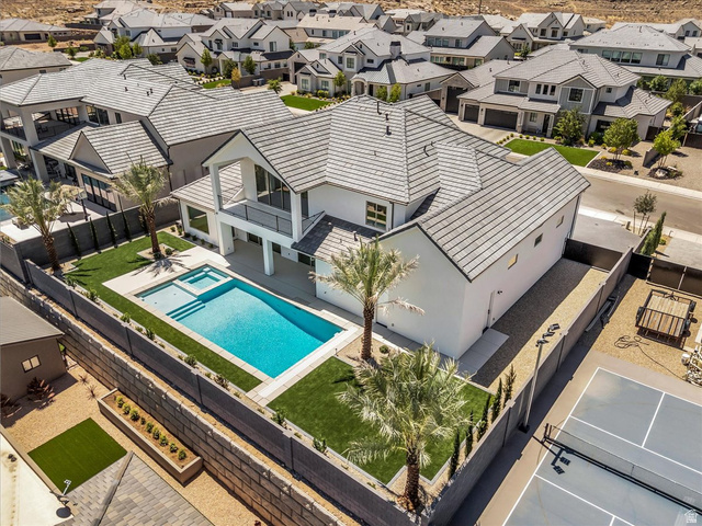 1620 Belayer Drive St. George, UT 84770 - Photo 49 of 51 Contemporary white exterior featuring a gabled roofline and multiple windows