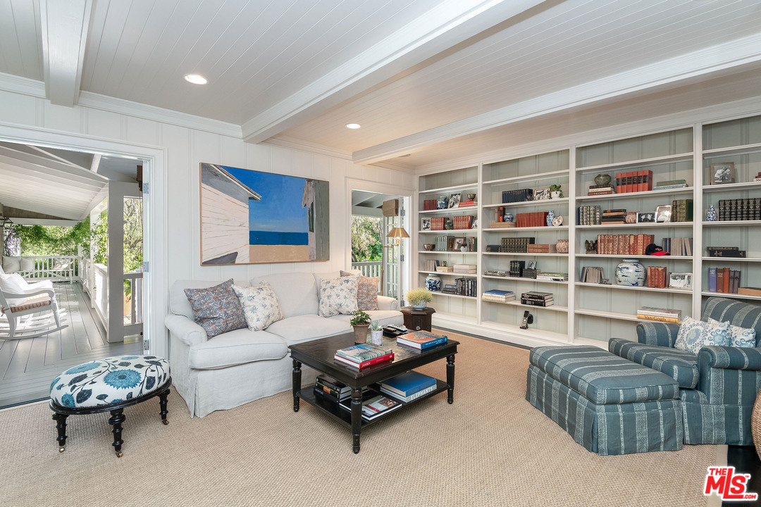 120 Homewood Road Los Angeles, CA 90049 - Photo 24 of 47 a living room with furniture and a large window