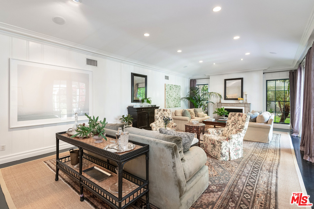120 Homewood Road Los Angeles, CA 90049 - Photo 26 of 47 a living room with furniture large window and wooden floor