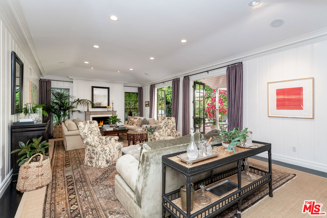 120 Homewood Road Los Angeles, CA 90049 - Photo 27 of 47 a living room with furniture potted plant and window