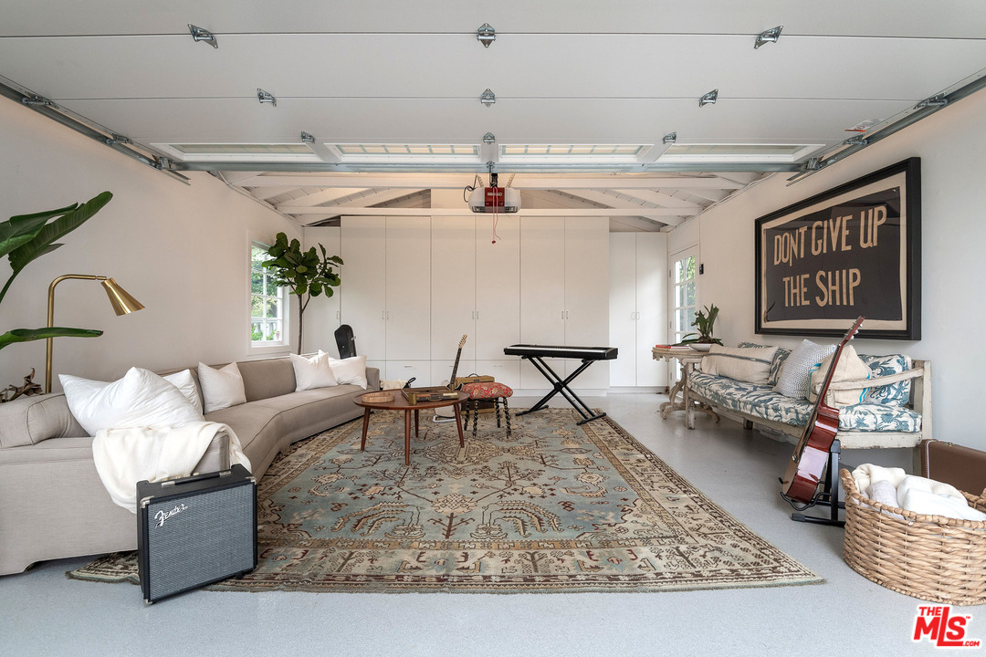 120 Homewood Road Los Angeles, CA 90049 - Photo 37 of 47 a living room with furniture and a rug