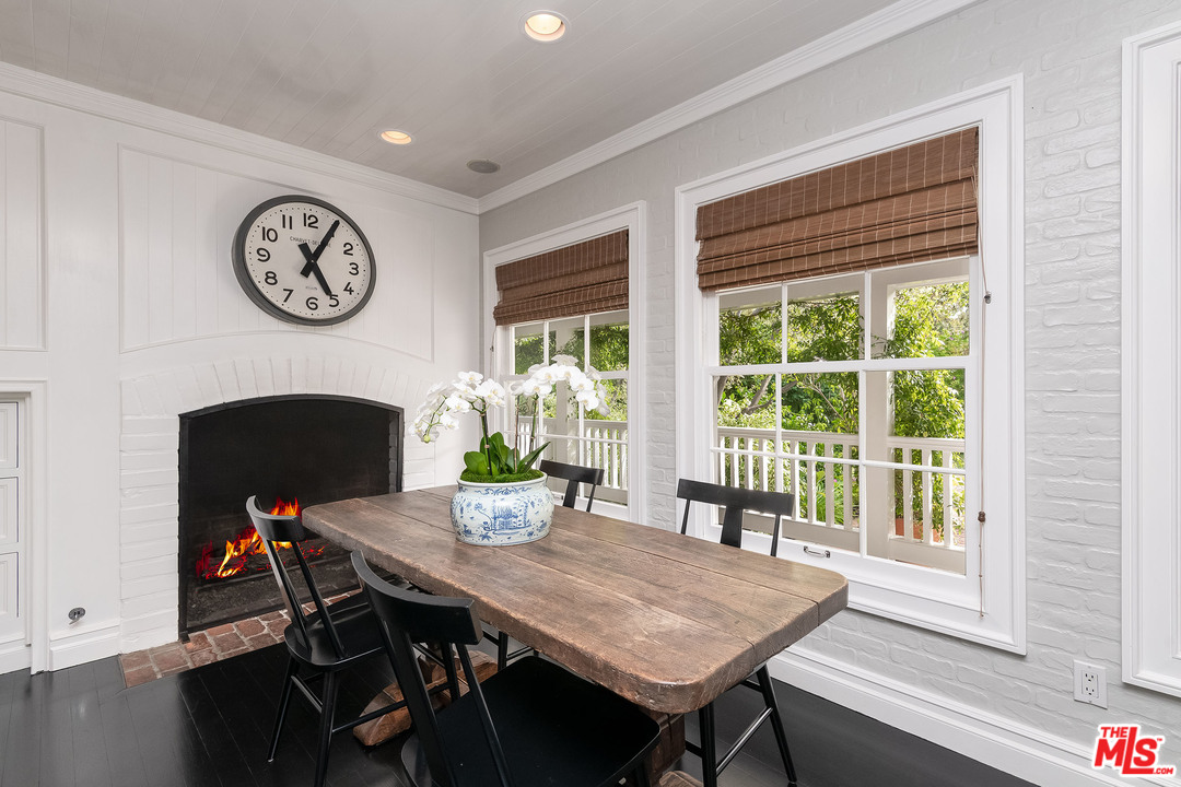 120 Homewood Road Los Angeles, CA 90049 - Photo 38 of 47 a view of a dining room with furniture window and wooden floor