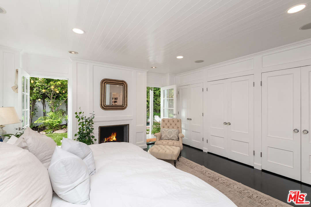120 Homewood Road Los Angeles, CA 90049 - Photo 43 of 47 a living room with furniture and a fireplace