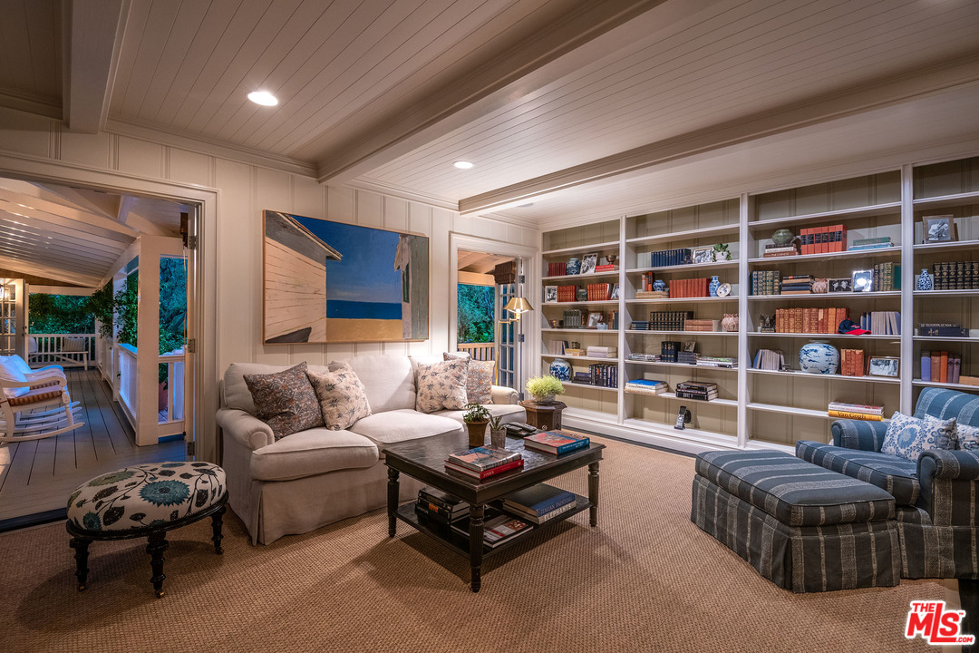 120 Homewood Road Los Angeles, CA 90049 - Photo 6 of 47 a living room with furniture and a book shelf