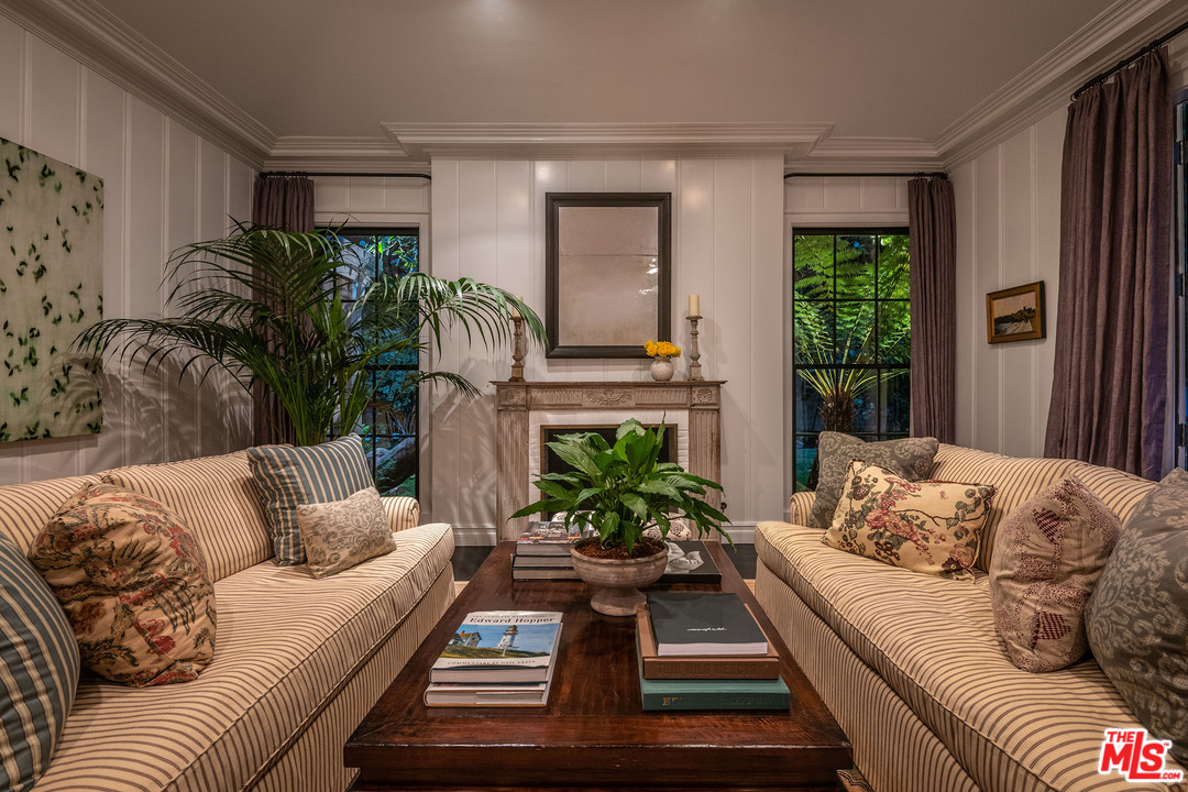 120 Homewood Road Los Angeles, CA 90049 - Photo 8 of 47 a living room with furniture fireplace and potted plant
