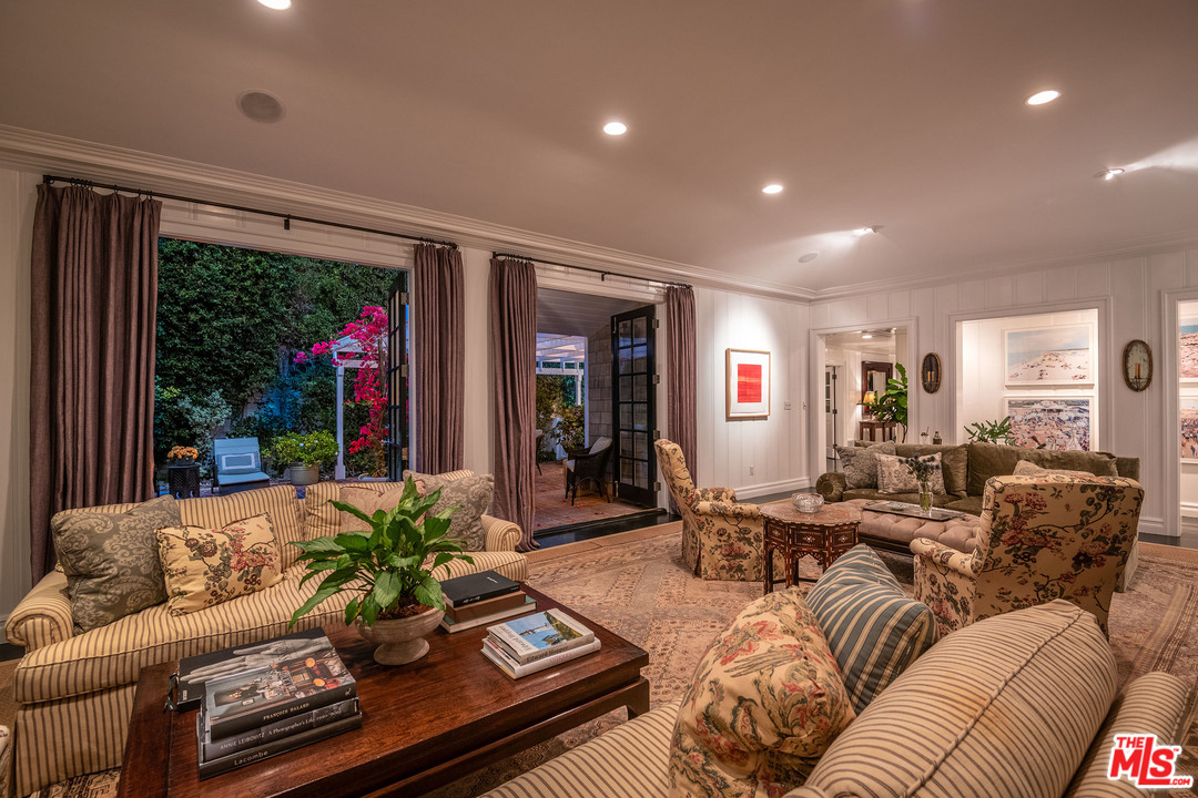 120 Homewood Road Los Angeles, CA 90049 - Photo 9 of 47 a living room with furniture and a large window