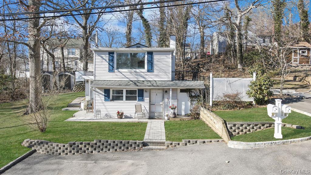 7 Yucca Road, Unit UPPR Rocky Point, NY 11778 - Photo 2 of 18 front view of house with a yard