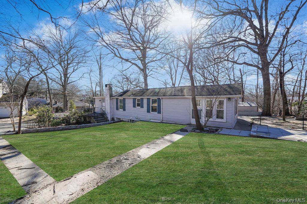 7 Yucca Road, Unit UPPR Rocky Point, NY 11778 - Photo 4 of 18 a view of a house with a yard and sitting area