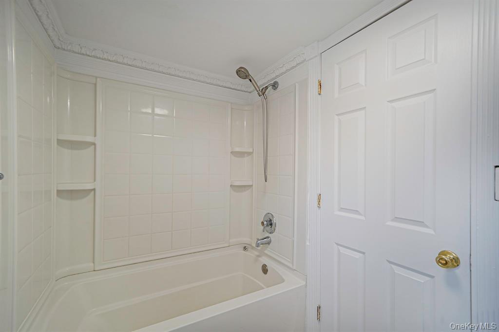 7 Yucca Road, Unit UPPR Rocky Point, NY 11778 - Photo 8 of 18 a bathroom with a bathtub