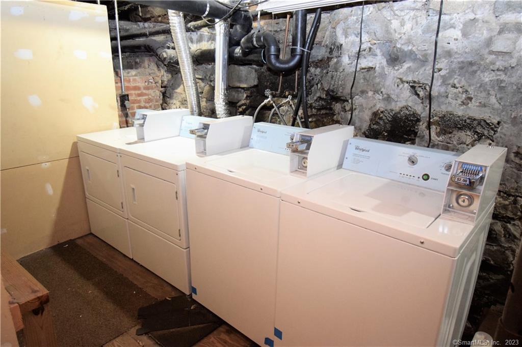 28 Drive Way, Unit 2L Guilford, CT 06437 - Photo 16 of 16 2 WASHER'S & 2 DRYER'S IN COMMON AREA BASEMENT WITH DESIGNATED STORAGE AREA