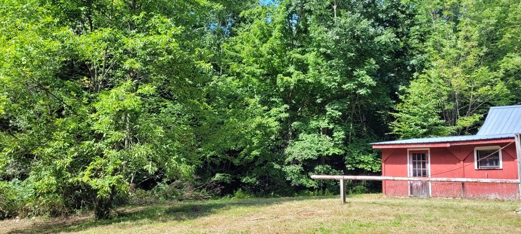 225 Gulf Road Belchertown, MA 01007 - Photo 32 of 32 a backyard of a house with table and chairs