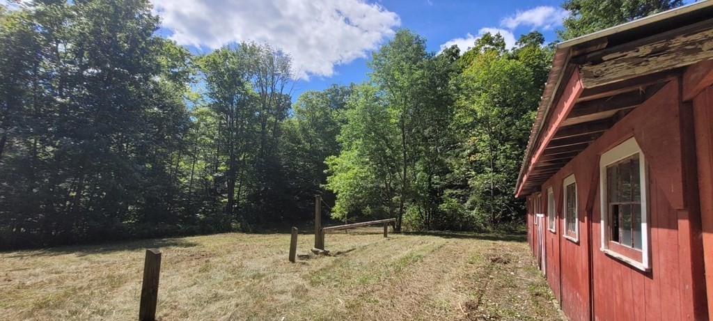 225 Gulf Road Belchertown, MA 01007 - Photo 4 of 32 a backyard of a house with lots of green space