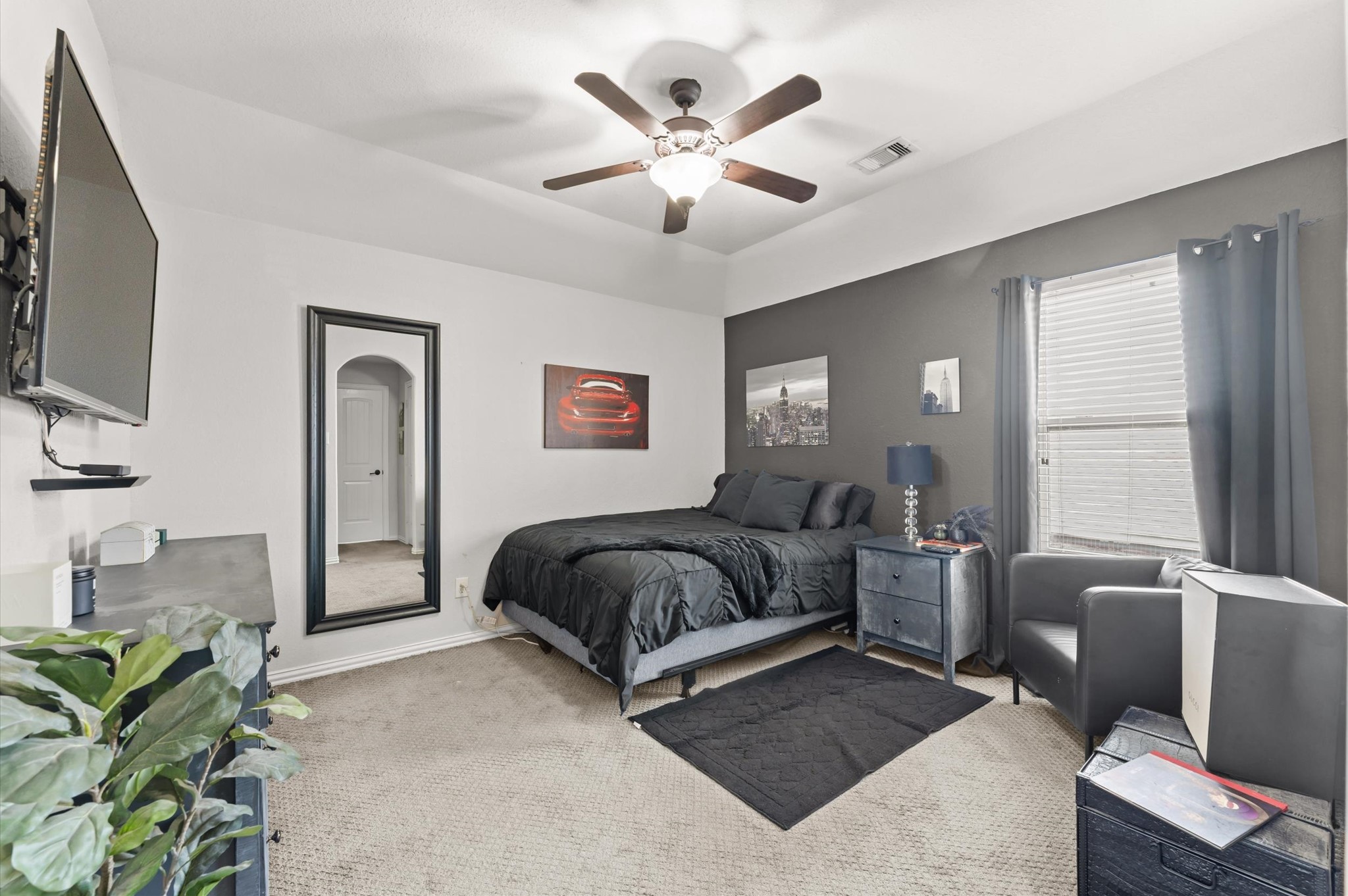 14016 Savannah Landing Lane Rosharon, TX 77583 - Photo 32 of 49 a spacious bedroom with a bed couch and window