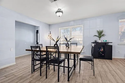 a view of a livingroom with furniture and wooden floor